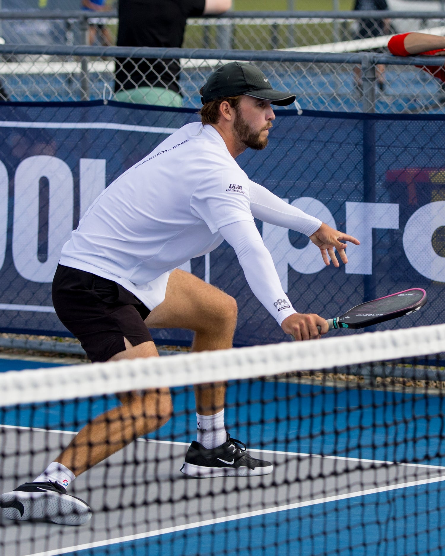Pickleball player in action on a court